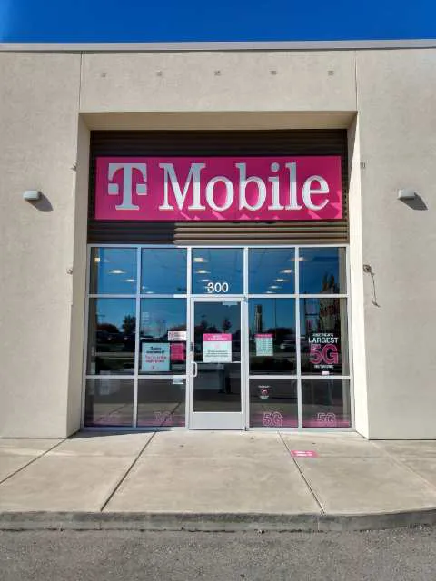  Exterior photo of T-Mobile store at N Rock Rd & E Tall Tree Rd, Derby, KS 