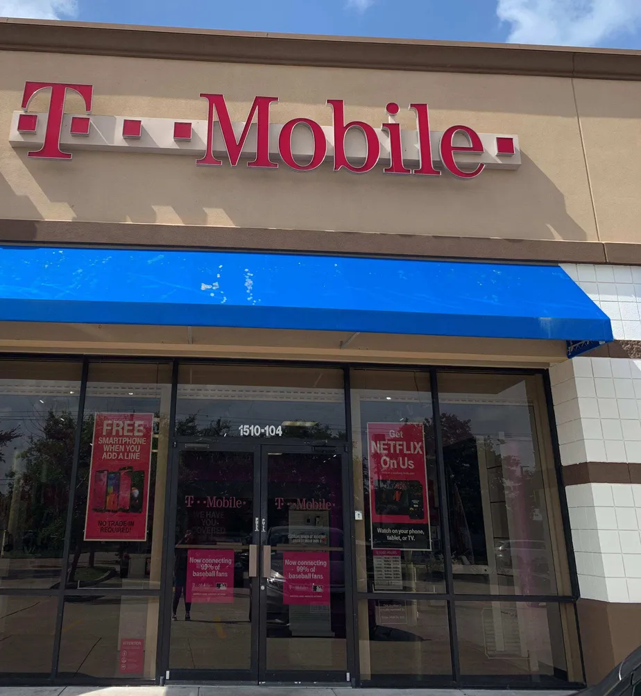 Exterior photo of T-Mobile store at E Broadway & Dixie Farm Rd, Pearland, TX