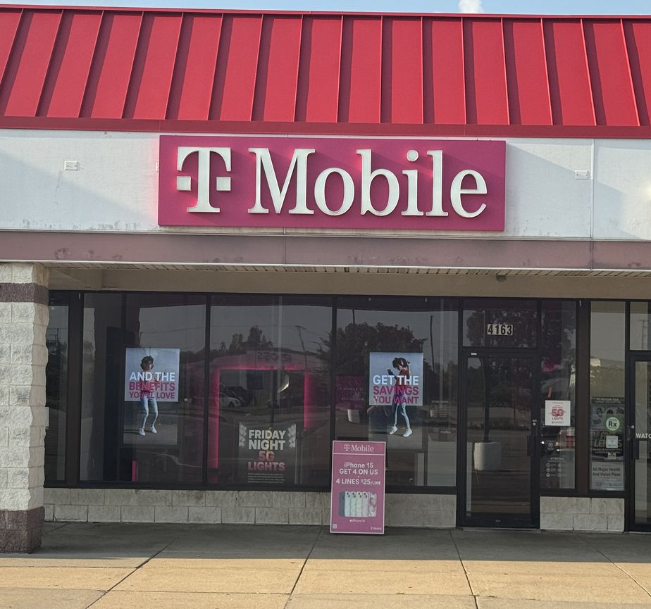 Exterior photo of T-Mobile Store at The Courtyard Shopping Center, Burton, MI