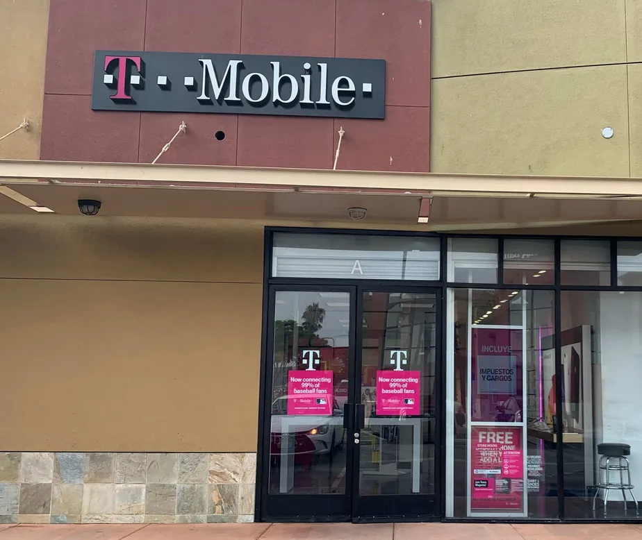 Exterior photo of T-Mobile store at Coliseum Pl & Crenshaw, Los Angeles, CA