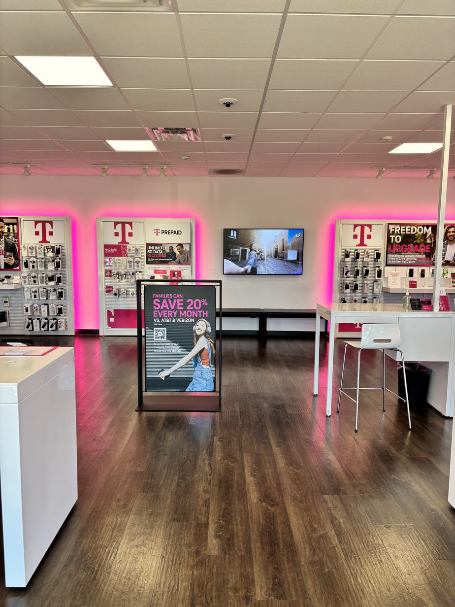 Interior photo of T-Mobile Store at Cooper & Simmons, Henderson, NC