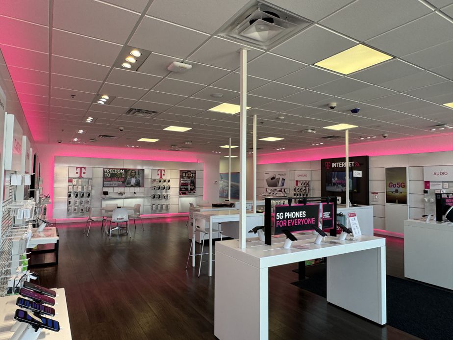 Interior photo of T-Mobile Store at Mills Civic Pkwy & S 64th St, West Des Moines, IA