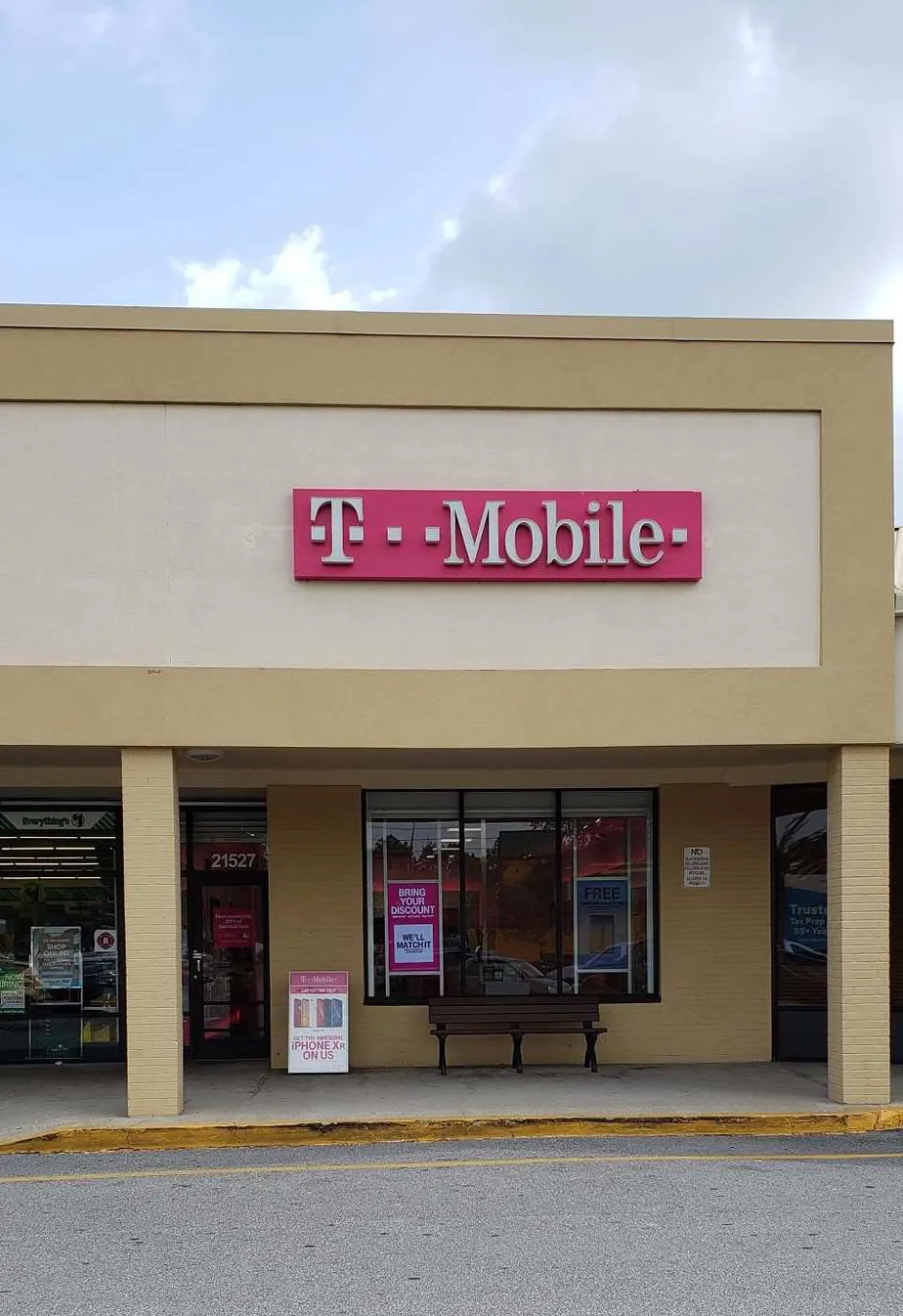 Exterior photo of T-Mobile store at Village Lk Shopping Cen Dr & Sr-54, Land O Lakes, FL