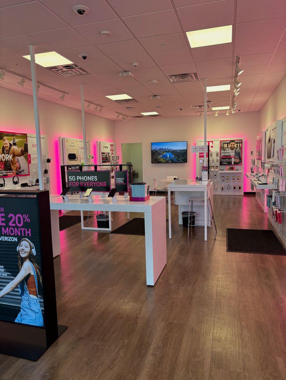 Interior photo of T-Mobile Store at Blues Hwy & 2nd Ave, Muscatine, IA