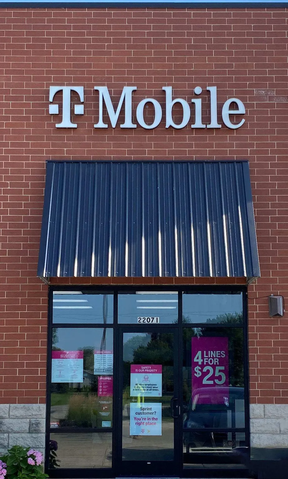 Exterior photo of T-Mobile store at N Us Hwy 12 & Short St, Spring Grove, IL
