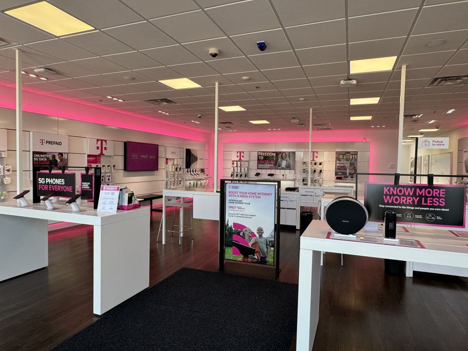 Interior photo of T-Mobile Store at Mills Civic Pkwy & S 64th St, West Des Moines, IA