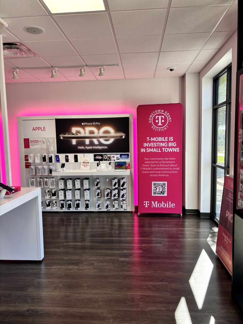 Interior photo of T-Mobile Store at Cooper & Simmons, Henderson, NC