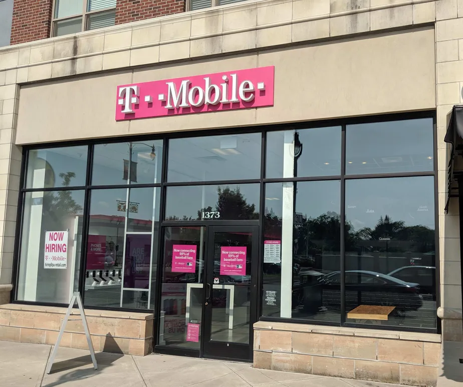 Exterior photo of T-Mobile store at Mt Hope Ave & Celebration Dr, Rochester, NY