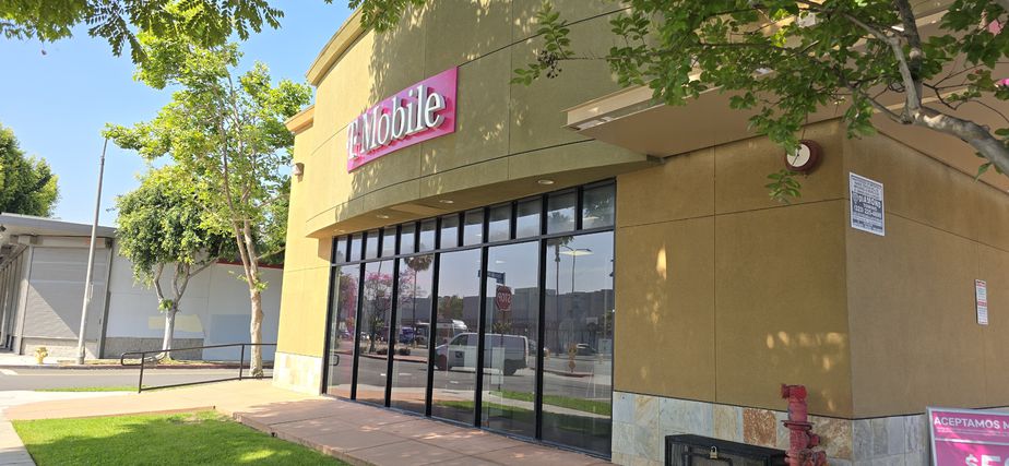 Exterior photo of T-Mobile Store at Coliseum Pl & Crenshaw, Los Angeles, CA