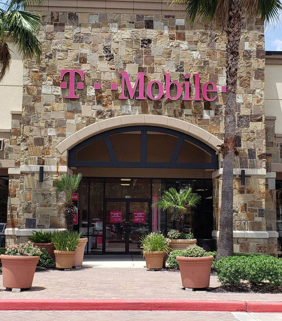 Exterior photo of T-Mobile store at Rayford Rd & Imperial Oaks Blvd, Spring, TX