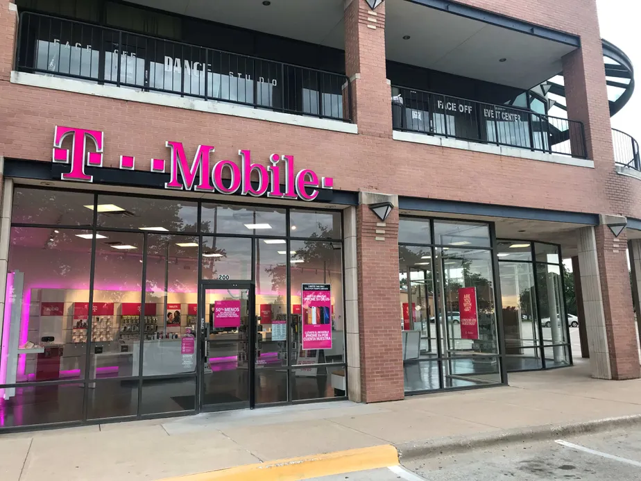 Exterior photo of T-Mobile store at Arkansas Ln & Cooper St, Arlington, TX