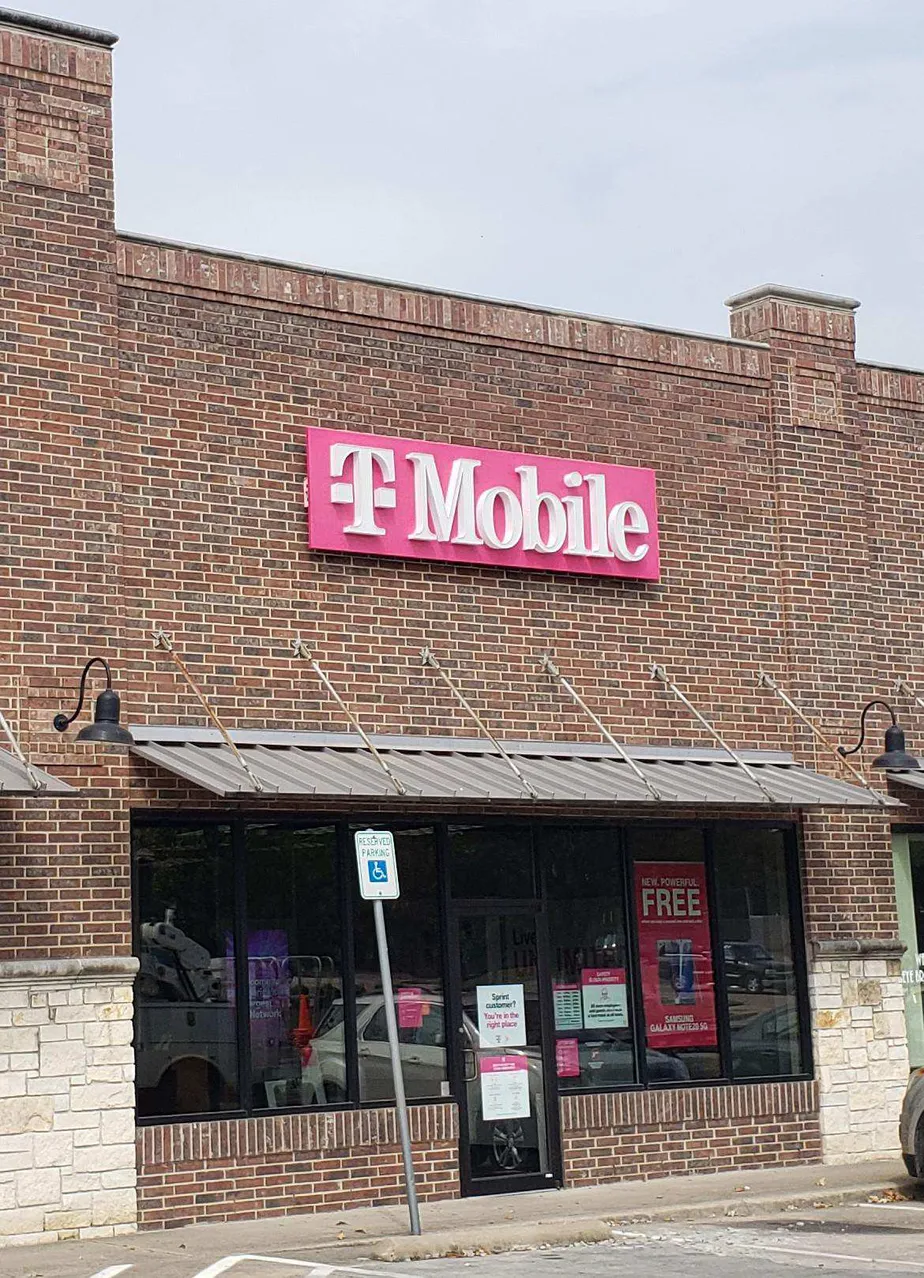 Exterior photo of T-Mobile store at E Ennis Ave & Laurel St, Ennis, TX