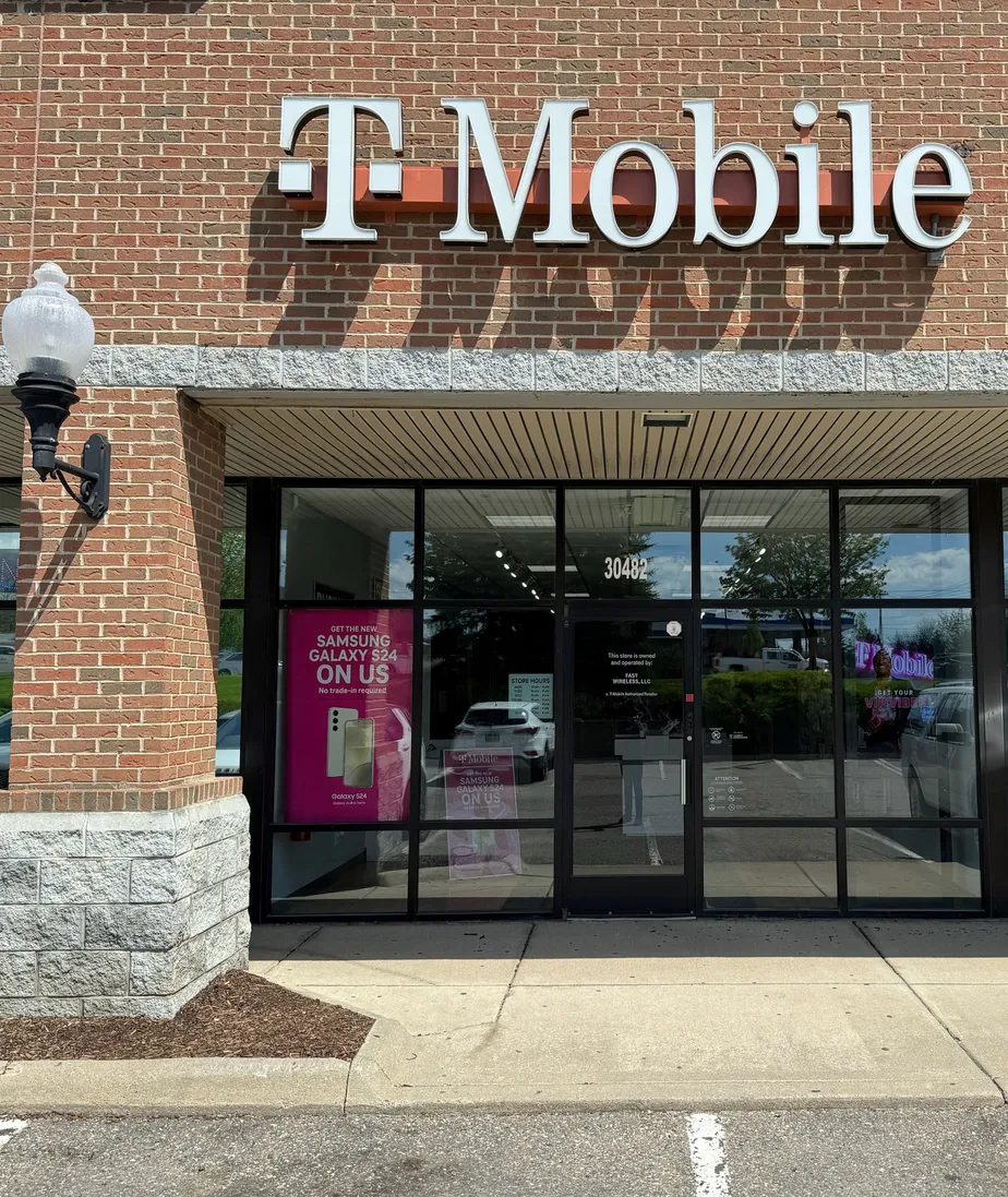  Exterior photo of T-Mobile Store at Milford Rd & Lyon Center Dr E, New Hudson, MI 