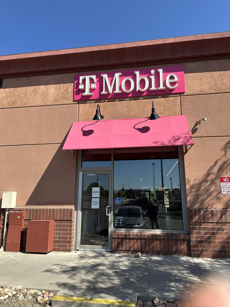Exterior photo of T-Mobile Store at E Cedar Ave & Crystal St, Aurora, CO