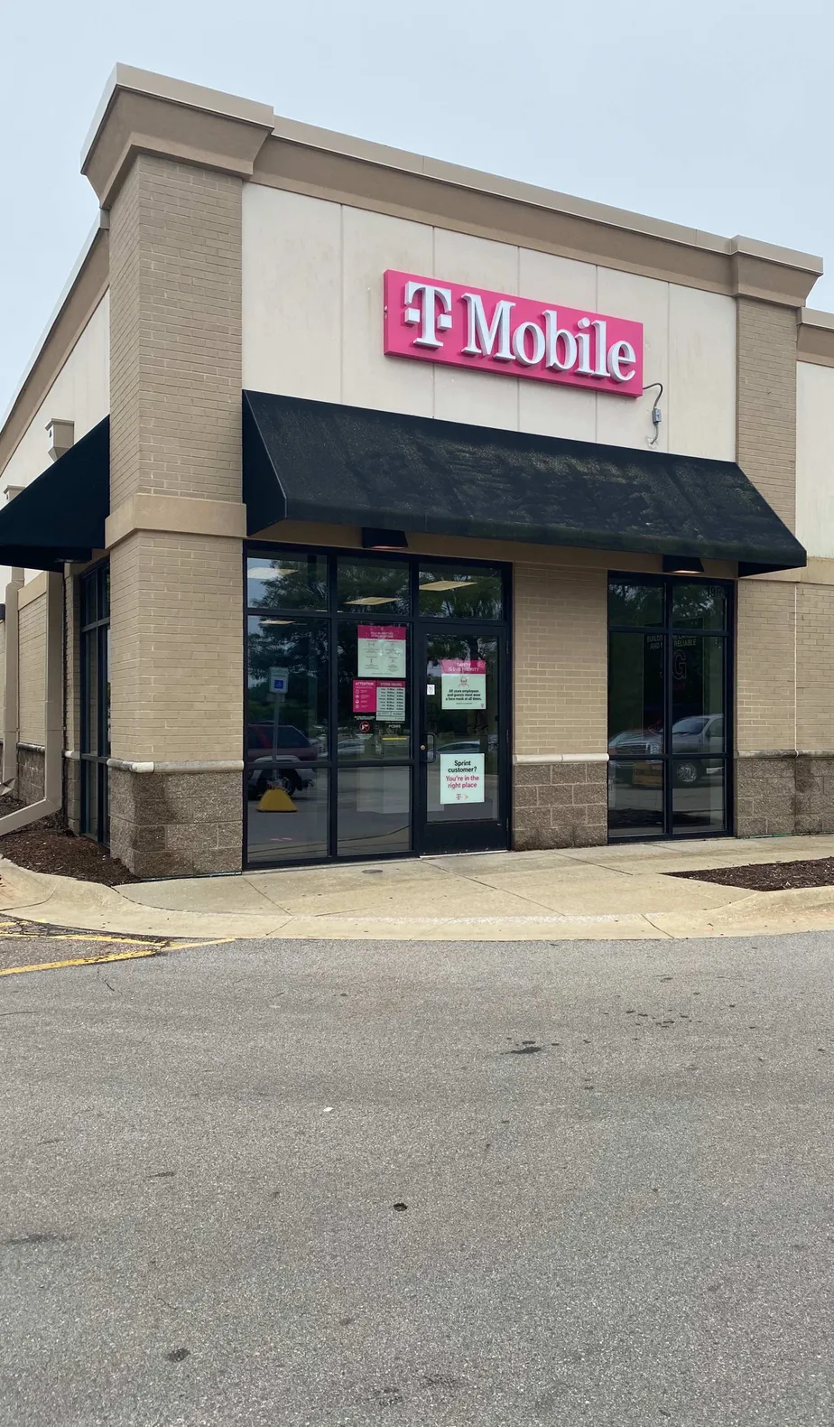  Exterior photo of T-Mobile store at W Grand River Ave & Marsh Rd, Okemos, MI 