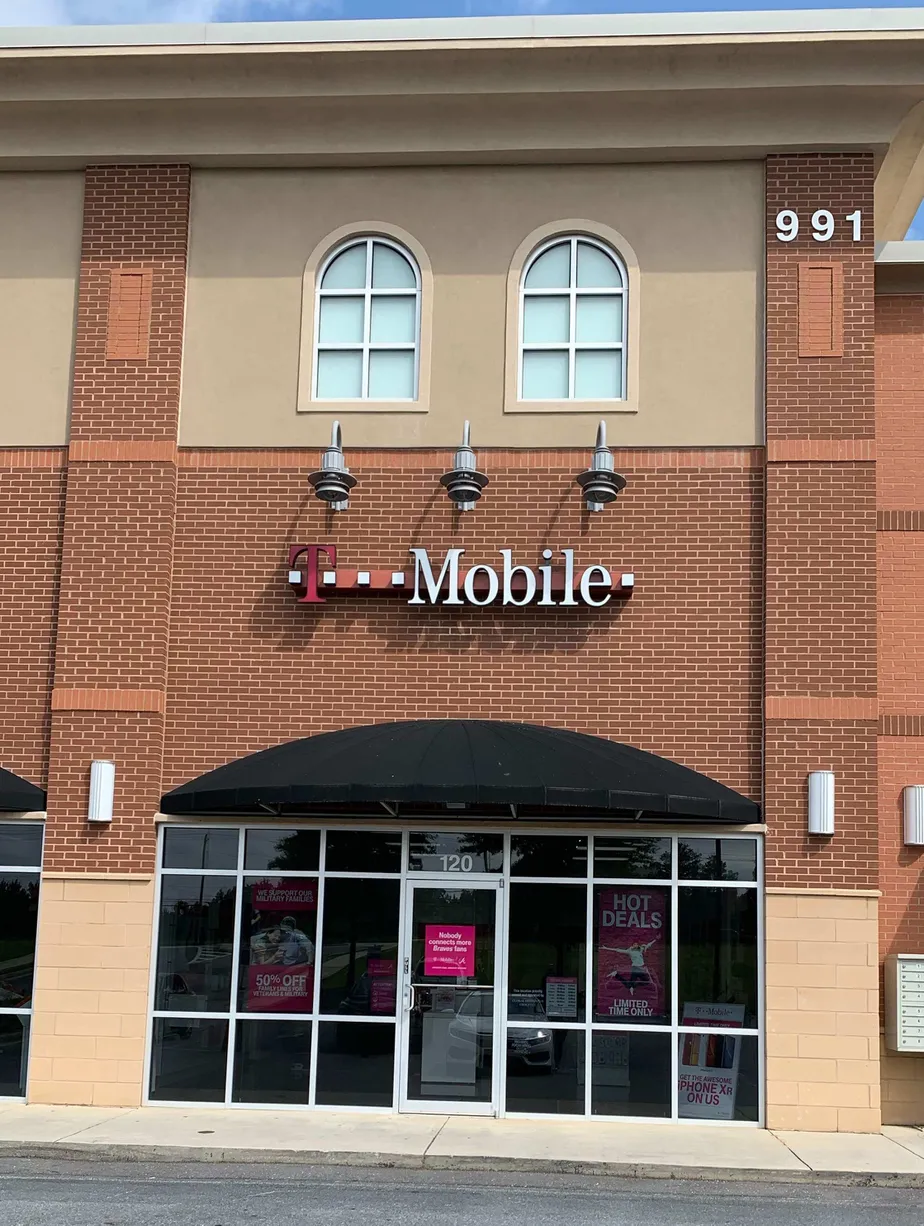 Exterior photo of T-Mobile store at Peachtree Industrial Blvd & Moore Rd, Suwanee, GA