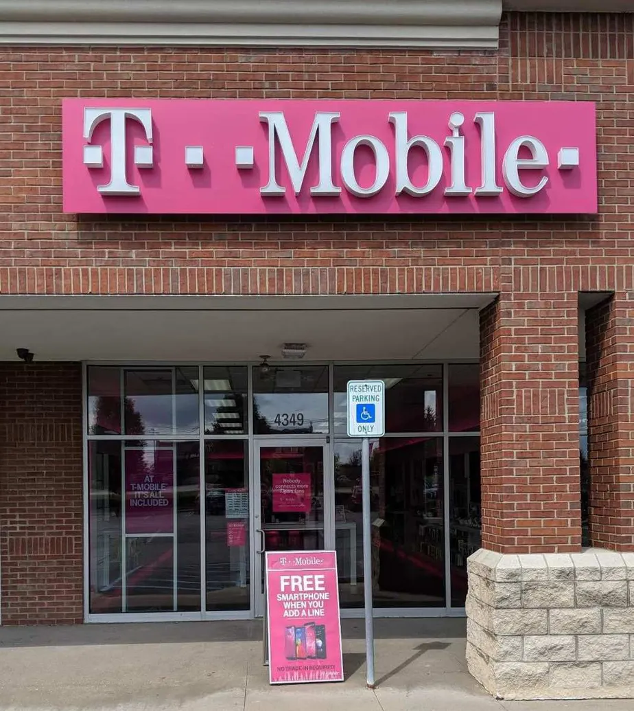 Exterior photo of T-Mobile store at E Grand River Ave & Westbury Blvd, Howell, MI
