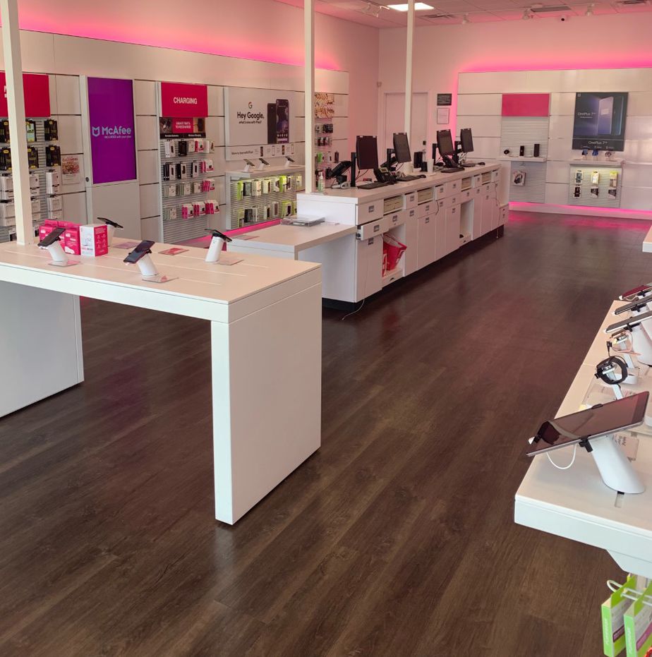 Interior photo of T-Mobile Store at Pontiac Trail & Eight Mile Rd, South Lyon, MI