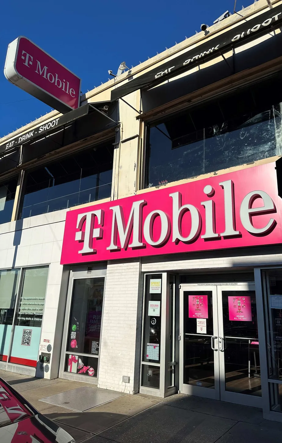 Exterior photo of T-Mobile Store at Austin St & Continental Ave, Forest Hills, NY