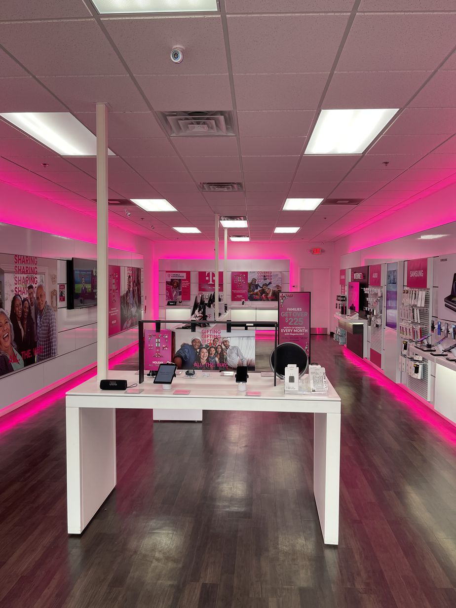Interior photo of T-Mobile Store at Pontiac Trail & Huntley Dr, Commerce, MI